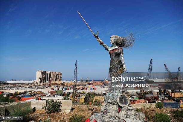 Statue of a woman by Lebanese artist Hayat Nazer, made out of leftover glass, rubble, and a broken clock marking the time of the mega explosion at...