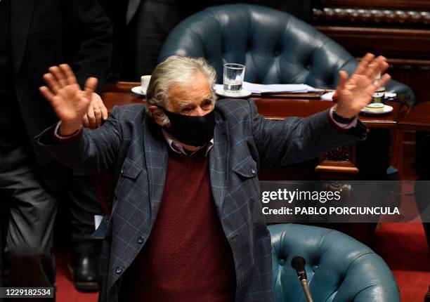 Uruguayan former president Jose Mujica waves goodbye after presenting his resignation as senator, at the Congress in Montevideo on October 20, 2020....