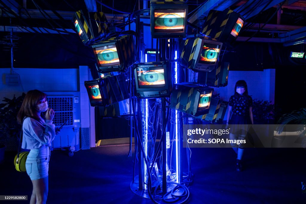 Visitors are seen at an exhibition called 'Heart of...