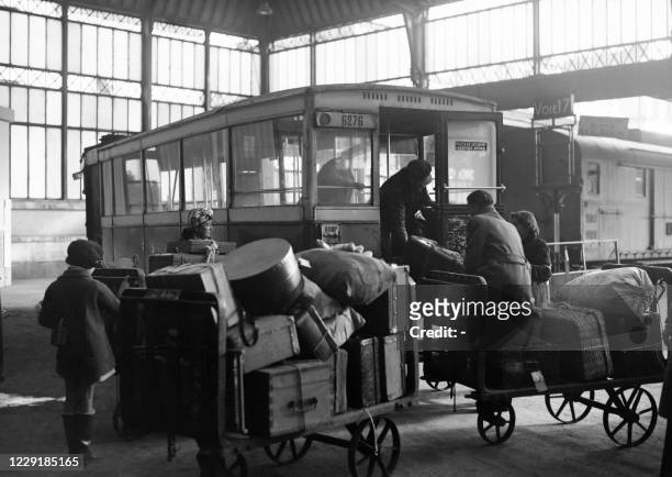 Refugees and repatriates arrive at a reception center of the French Red Cross, installed in a Parisian train station, in Paris in February 1945.