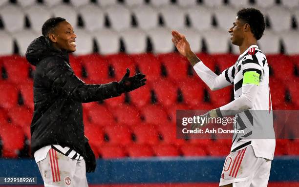 Marcus Rashford of Manchester United celebrates with Anthony Martial at the end of the UEFA Champions League Group H stage match between Paris...
