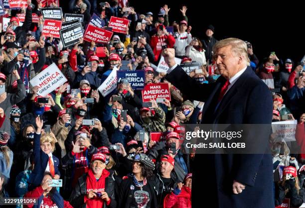 President Donald Trump arrives to hold a Make America Great Again rally as he campaigns at Erie International Airport in Erie, Pennsylvania, October...