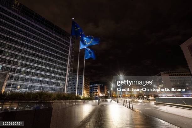 European flags fly in front of the Berlaymont. The building of the European Parliament on October 20, 2020 in Brussels, Belgium. Bars and restaurants...