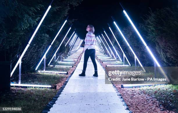 Visitor walks through one of the installations in the woodlands and hidden gardens of Hopetoun House, South Queensferry, during a preview of the...