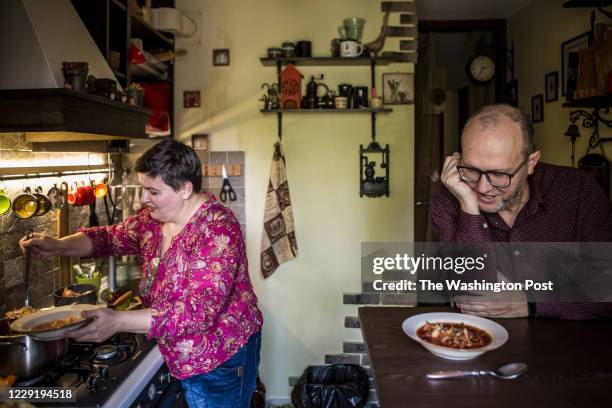 October 15: Oksana Chadaieva ladles borscht into a bowl for the meal with her family in Kyiv, Ukraine on October 15, 2020. Chadaieva loves to cook...