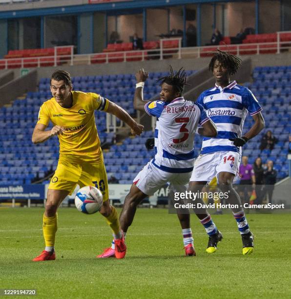 Wycombe Wanderers' Matthew Bloomfield holds off the challenge from Reading's Omar Richards during the Sky Bet Championship match between Reading and...