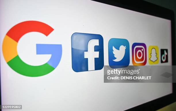 Photo taken on October 21, 2020 shows the logo of the multinational American Internet technology and services company, from left : Google, the...