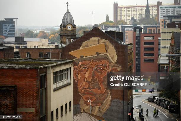 The "Steelworker" Brick Mural by Paul Waplington, representing the past industrial boom, is pictured in central Sheffield, south Yorkshire on October...