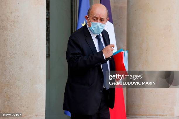 French European and Foreign Affairs Minister Jean-Yves Le Drian leaves the Elysee presidential Palace in Paris after attending the weekly cabinet...