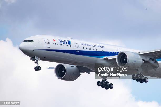 All Nippon Airways Boeing 777-300ER aircraft as seen on final approach with landing gear extended, flying and ready for landing at London Heathrow...