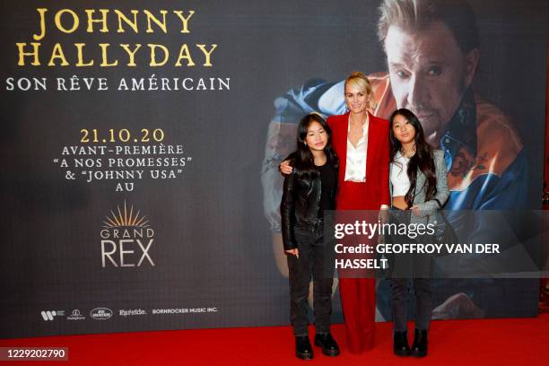 Laeticia Hallyday , widow of late French singer Johnny Hallyday poses with their daughters Jade an Joy upon their arrival at the premiere of "Johnny...