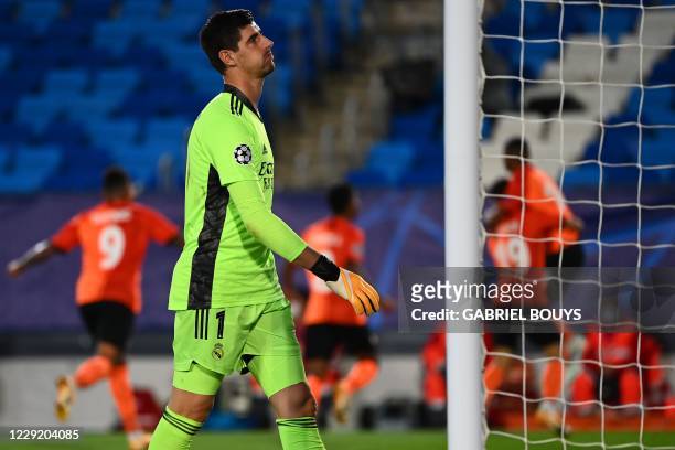 Real Madrid's Belgian goalkeeper Thibaut Courtois reacts after conceding a third goal during the UEFA Champions League group B football match between...