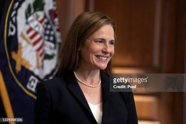 Supreme Court nominee Judge Amy Coney Barrett participates in a photo op with Sen. Martha McSally in the Mansfield Room of the U.S. Capitol prior to...