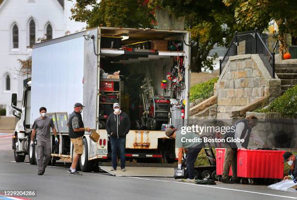 Film crew electricians load up a trailer truck Tuesday morning in Downtown Hingham, MA on Oct. 20, 2020 after filming scenes Monday in that location...