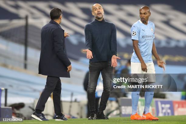 Manchester City's Spanish manager Pep Guardiola gestures as he exchanges words with Porto's Portuguese coach Sergio Conceicao during the UEFA...