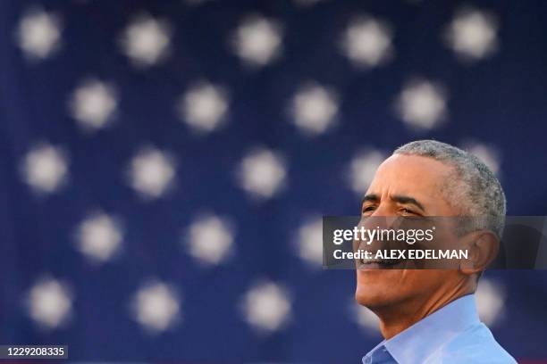 Former US President Barack Obama addresses Biden-Harris supporters during a drive-in rally in Philadelphia, Pennsylvania on October 21, 2020. -...