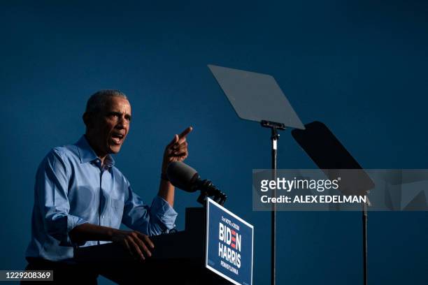 Former US President Barack Obama addresses Biden-Harris supporters during a drive-in rally in Philadelphia, Pennsylvania on October 21, 2020. Former...