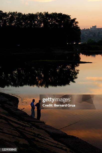 fishing golden clouds - bernard grua stock pictures, royalty-free photos & images