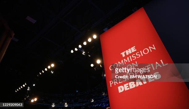 The Commission on Presidential Debates banner is seen as the stage for the final presidential debate of the US 2020 presidential elections, fitted...