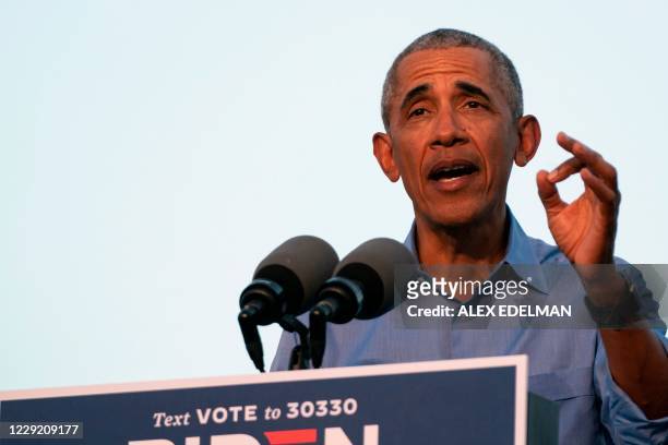 Former US President Barack Obama addresses Biden-Harris supporters during a drive-in rally in Philadelphia, Pennsylvania on October 21, 2020. -...