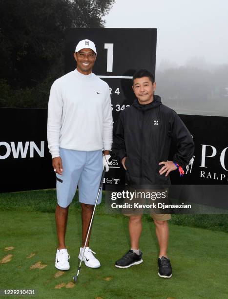 Yusaku Maezawa, founder and former CEO of Zozo, poses with Tiger Woods on the first tee during the pro am ahead of the Zozo Championships at Sherwood...