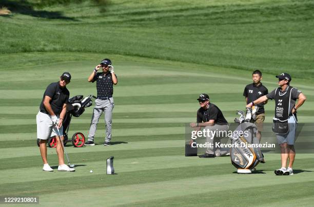 Phil Mickelson prepares to hit from the fourteenth fairway with Yusaku Maezawa, founder and former CEO of Zozo, during the pro am ahead of the Zozo...