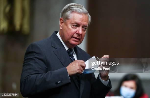 Senate Judiciary Committee Chairman Lindsey Graham arrives for a Senate Judiciary Committee meeting on the nomination of Judge Amy Coney Barrett to...