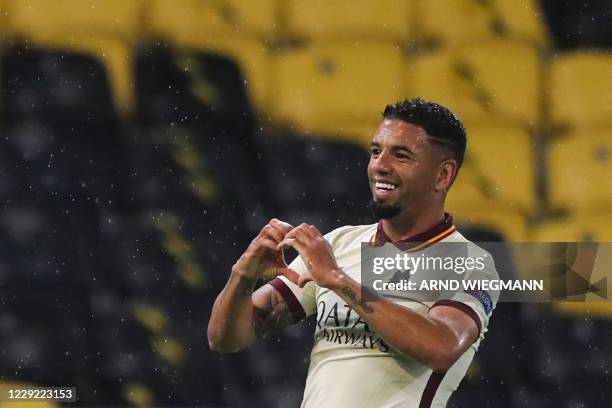 Roma's Brazilian defender Bruno Peres celebrates after scoring a goal during the UEFA Europa League Group A first-leg football match between Young...