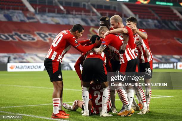 Players celebrate after scoring a goal during the UEFA Europa League group E football match between PSV Eindhoven and Granada CF at the PSV stadium...