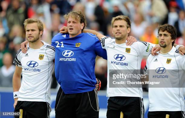 Maximilian Mueller, Max Weinhold, Moritz Fuerste, Tobias Hauke of Germany stand together prior to the EuroHockey 2011 final match between Netherlands...