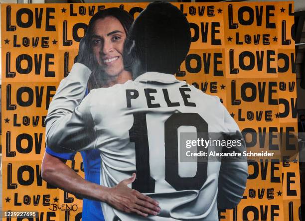 General view of a street work of art by Luis Bueno, known as BuenoCaos, that depicts soccer player Pelé hugging soccer player Marta Vieira da Silva...