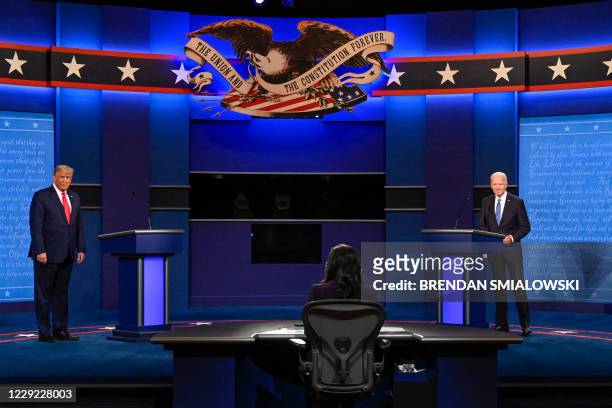 President Donald Trump and Democratic Presidential candidate and former US Vice President Joe Biden arrive on stage during the final presidential...