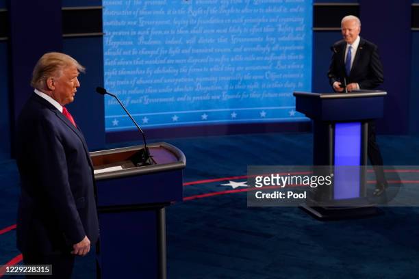 President Donald Trump and Democratic presidential candidate former Vice President Joe Biden walk on stage during the second and final presidential...