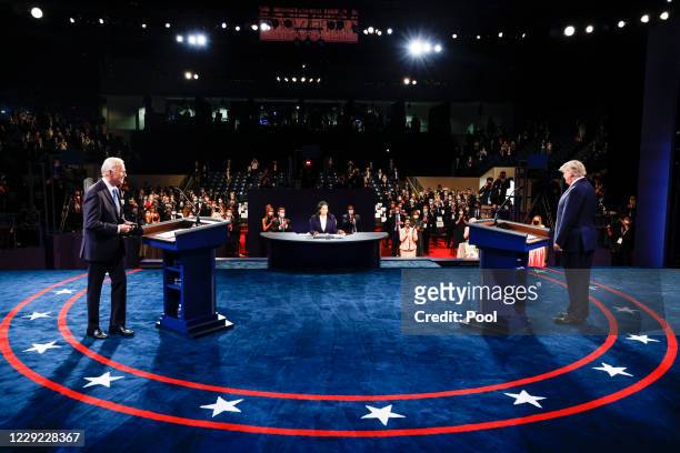 President Donald Trump and Democratic presidential nominee Joe Biden arrive onstage for the final presidential debate at Belmont University on...