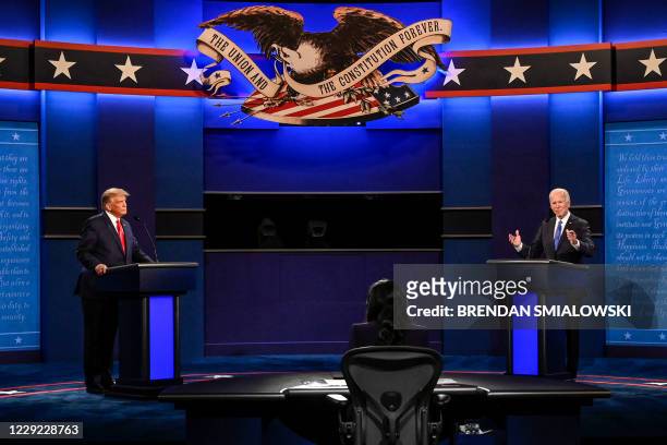 President Donald Trump and Democratic Presidential candidate and former US Vice President Joe Biden discuss on stage during the final presidential...