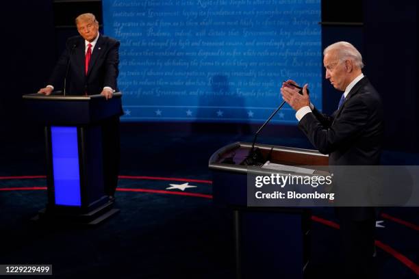 Joe Biden, 2020 Democratic presidential nominee, speaks as U.S. President Donald Trump, left, listens during the U.S. Presidential debate at Belmont...