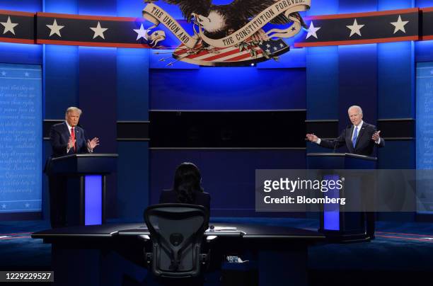Joe Biden, 2020 Democratic presidential nominee, right, and U.S. President Donald Trump speak during the U.S. Presidential debate at Belmont...