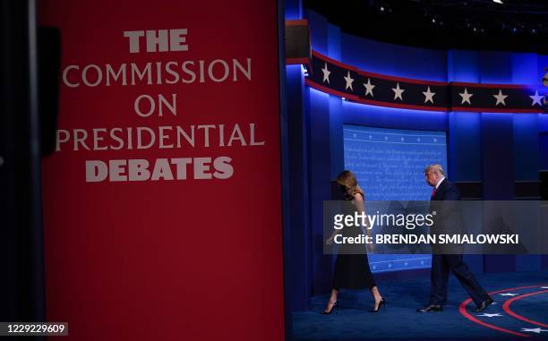President Donald Trump and US First Lady Melania Trump leave the stage at the end of the final presidential debate at Belmont University in...