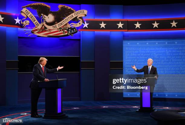 Joe Biden, 2020 Democratic presidential nominee, right, and U.S. President Donald Trump speak during the U.S. Presidential debate at Belmont...