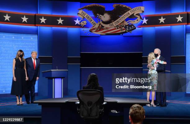 Joe Biden, 2020 Democratic presidential nominee, from right, wife Jill Biden, U.S. President Donald Trump and U.S. First Lady Melania Trump stand on...