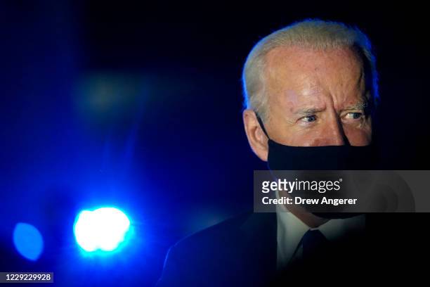 Democratic presidential nominee Joe Biden speaks to reporters before boarding his campaign plane at Nashville International Airport on October 22,...