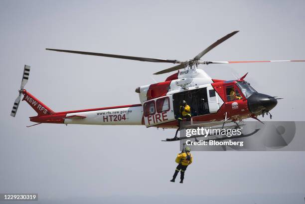 Members of the NSW Rural Fire Service perform a rescue demonstration during a display by the NSW Rural Fire Service, Fire and Rescue NSW and NSW...