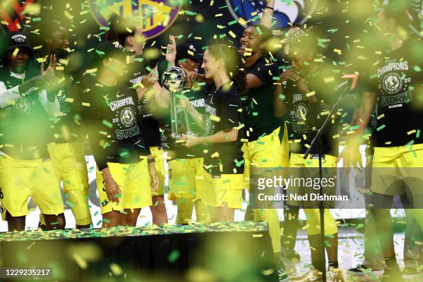 Sue Bird of the Seattle Storm accepts the WNBA Championship Trophy after defeating the Las Vegas Aces in Game Three of the WNBA Finals on October 6,...