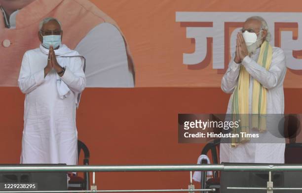 Prime Minister Narendra Modi and Bihar CM Nitish Kumar on stage during Modi's first public rally while campaigning for Bihar assembly election in...