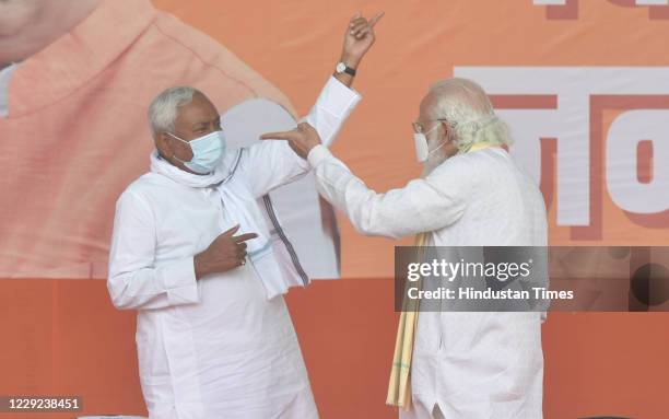 Prime Minister Narendra Modi and Bihar CM Nitish Kumar on stage during Modi's first public rally while campaigning for Bihar assembly election in...