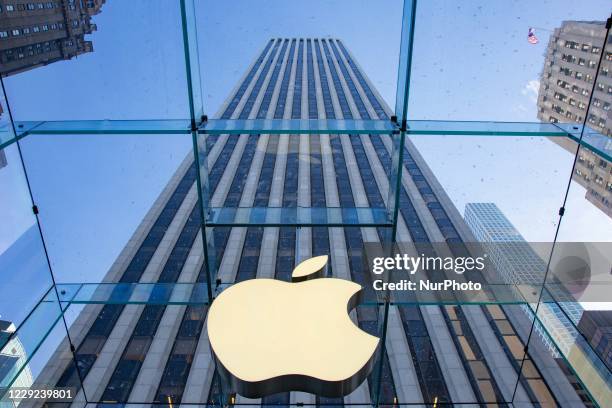 Apple flagship retail store in Fifth in New York City with the Iconic glass cube design from Peter Bohlin that received multiple architectural and...