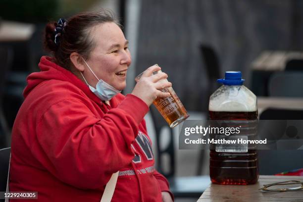 Customer drinks a pint of beer at the Duke of Wellington pub as bars and pubs prepare to close on October 23, 2020 in Cardiff, Wales. Wales will go...