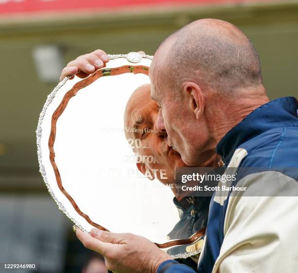 Glen Boss kisses the plate after winning the Ladbrokes Cox Plate at Moonee Valley Racecourse on October 23, 2020 in Moonee Ponds, Australia.