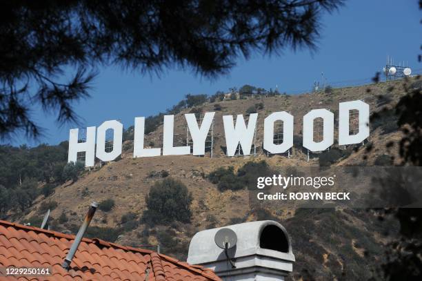 With AFP Story by Michael THURSTON: US-environment-technology-tourism The iconic Hollywood sign is seen from a street in a residential Hollywood...