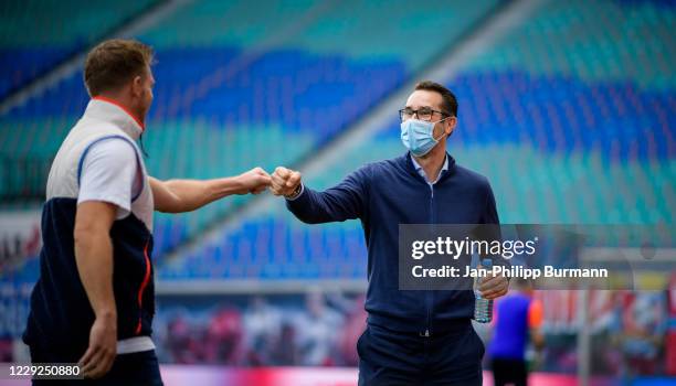 Coach Julian Nagelsmann of RB Leipzig and CEO Michael Preetz of Hertha BSC before the Bundesliga match between RB Leipzig and Hertha BSC at Red Bull...